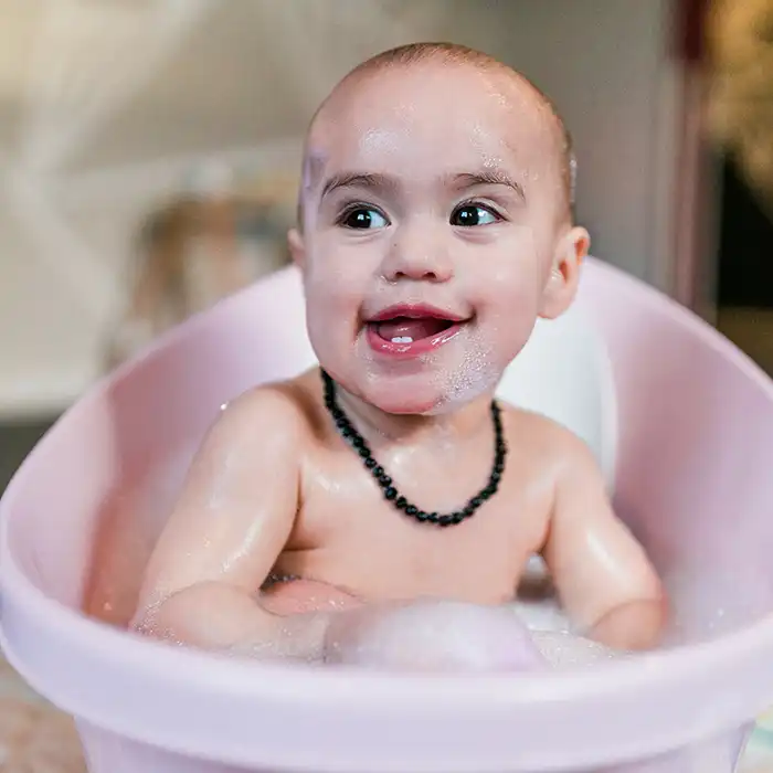 Smiling baby in a bath