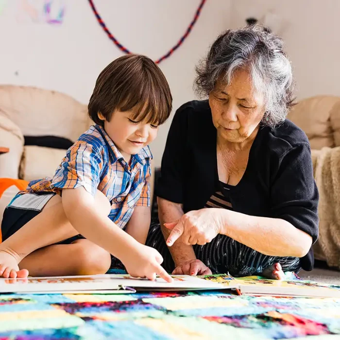 Grandmother and grandson play an activity
