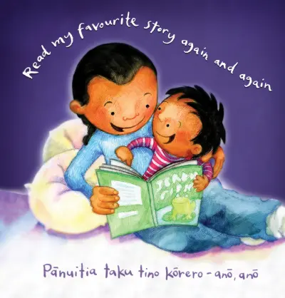 A parent enjoys reading a book with the young child on their lap . Text reads: "Read my favourite story again and again / Pānuitia taku tino kōrero – anō, anō."