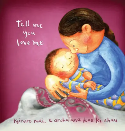 A mother gently cradles a sleeping newborn against their chest. Text reads: "Tell me you love me / Kōrero mai, e aroha ana koe ki ahau."